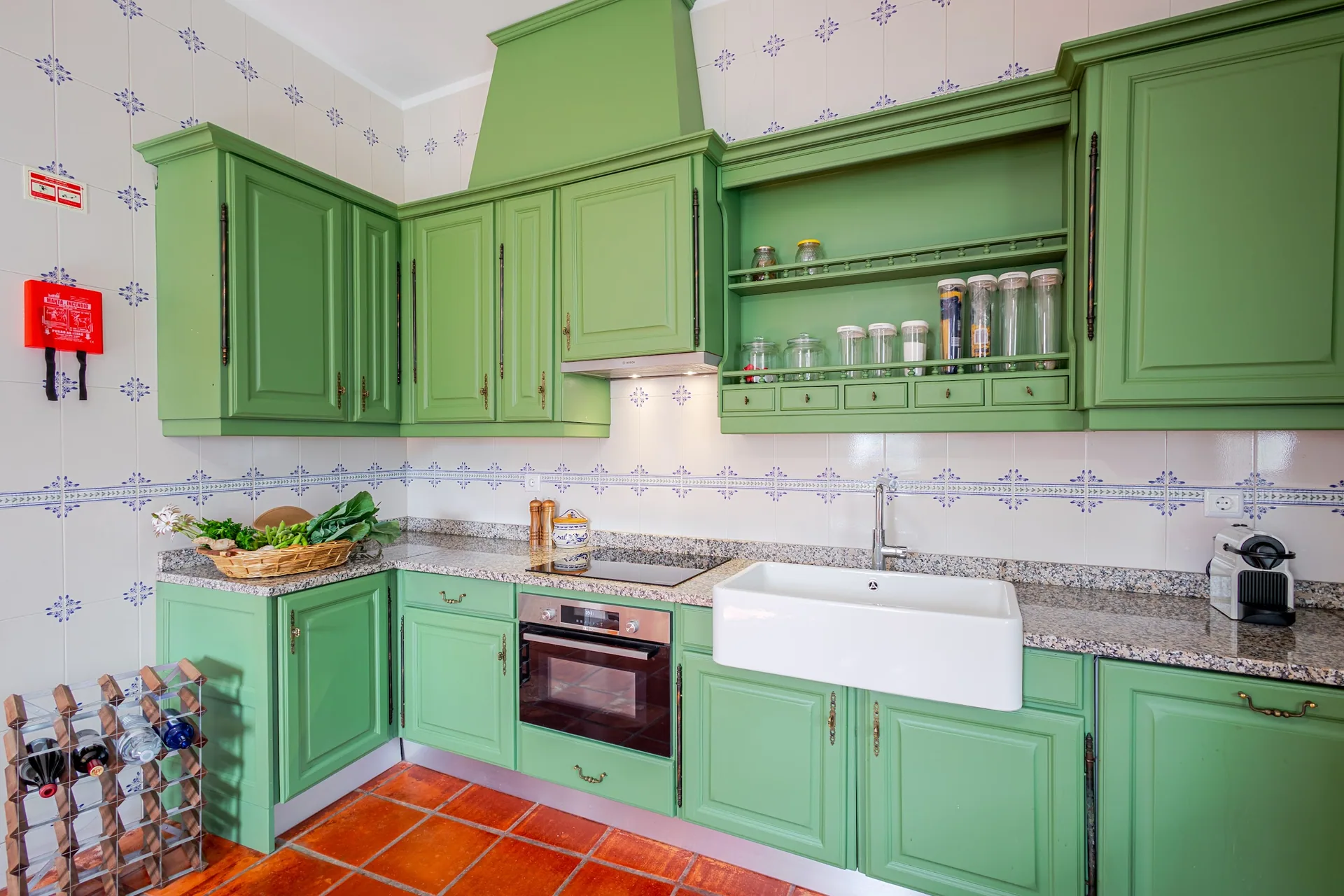 Green-toned kitchen with tiles