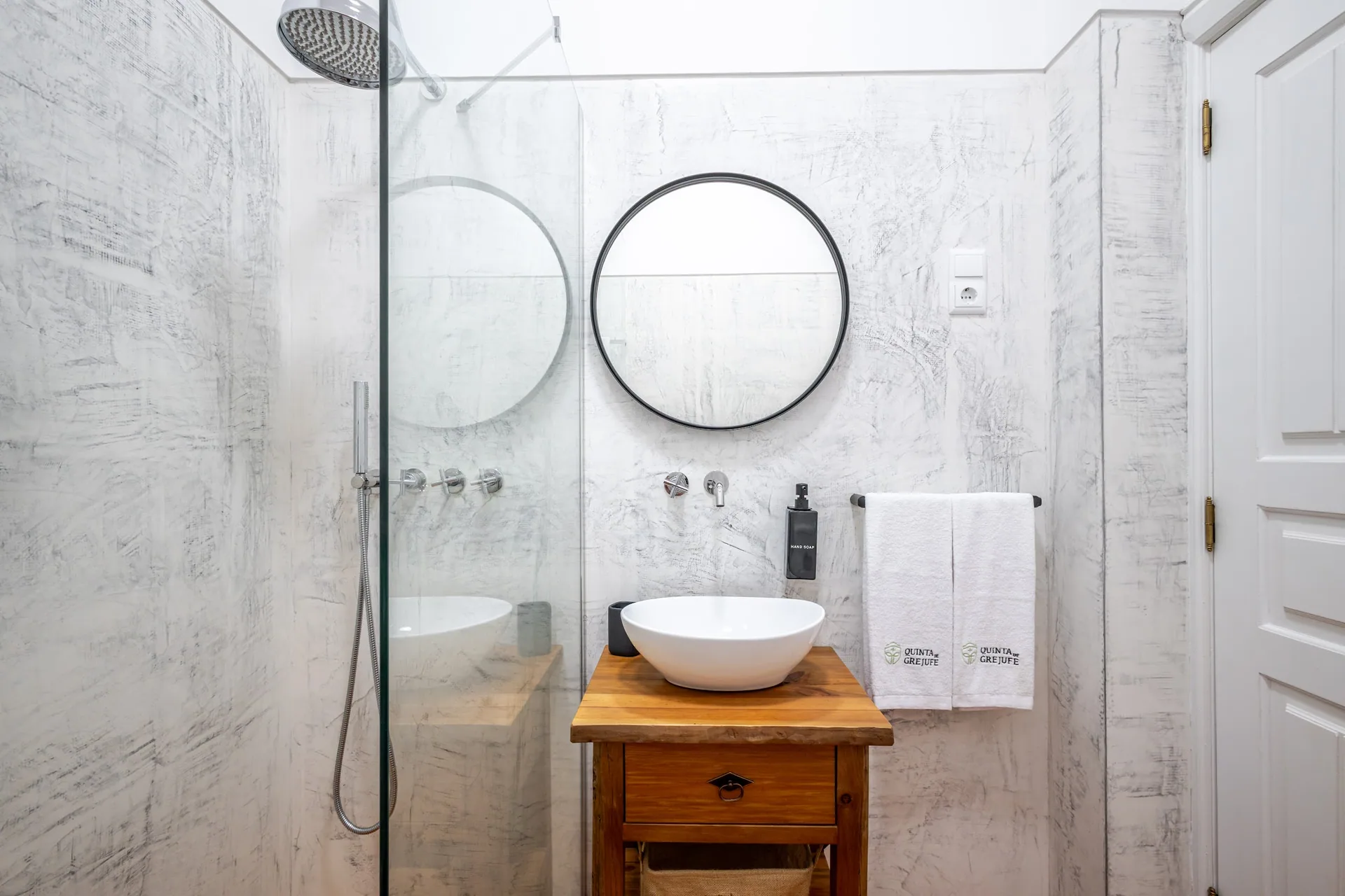 Light stone bathroom with walk-in shower