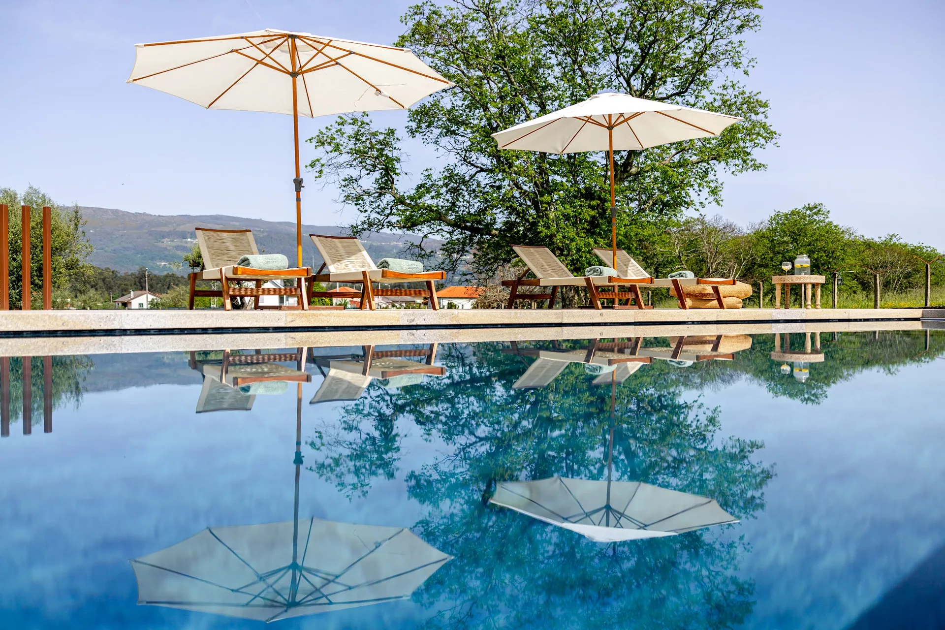 Parasols reflected in the pool