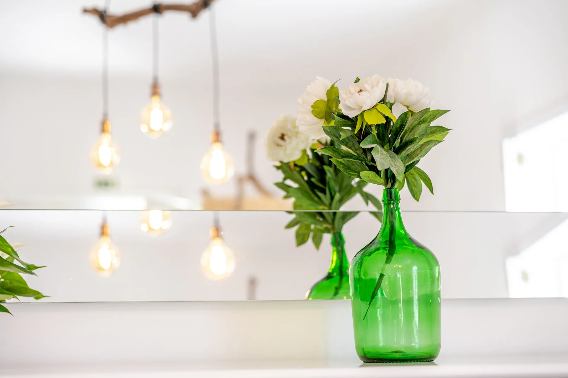 Flowers and pendant lamps indoors